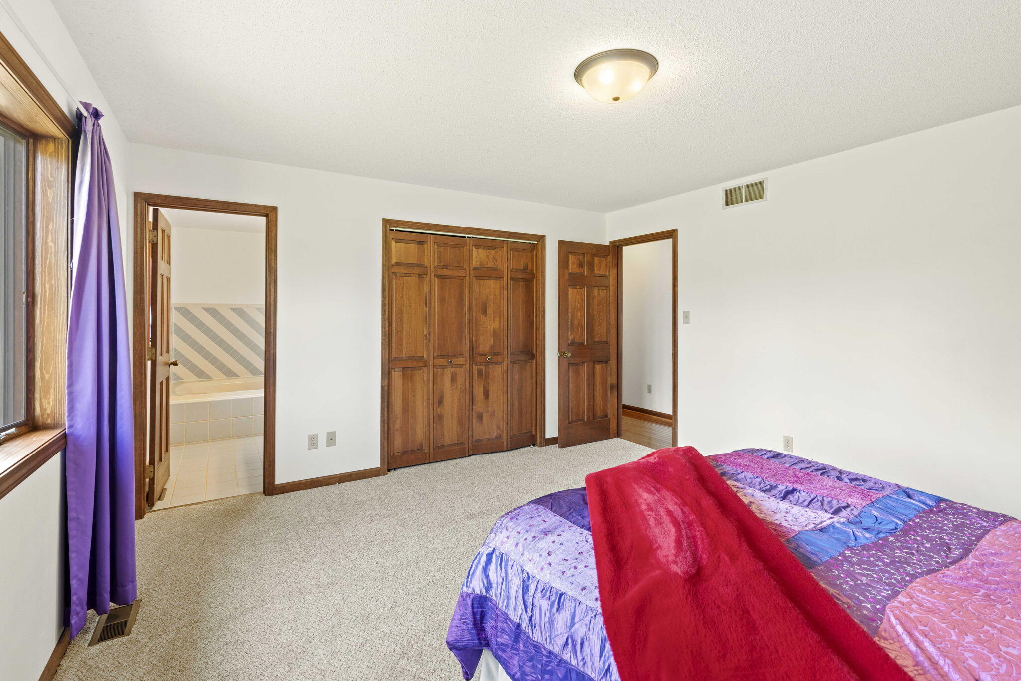654 Harvest Court Crown Point, IN 46307 - Photo 16 of 43 a bedroom with a bed and a window