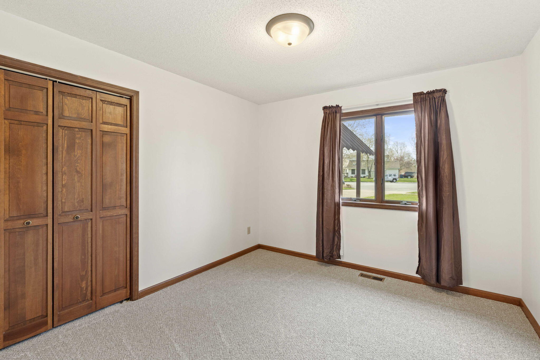 654 Harvest Court Crown Point, IN 46307 - Photo 21 of 43 an empty room with windows