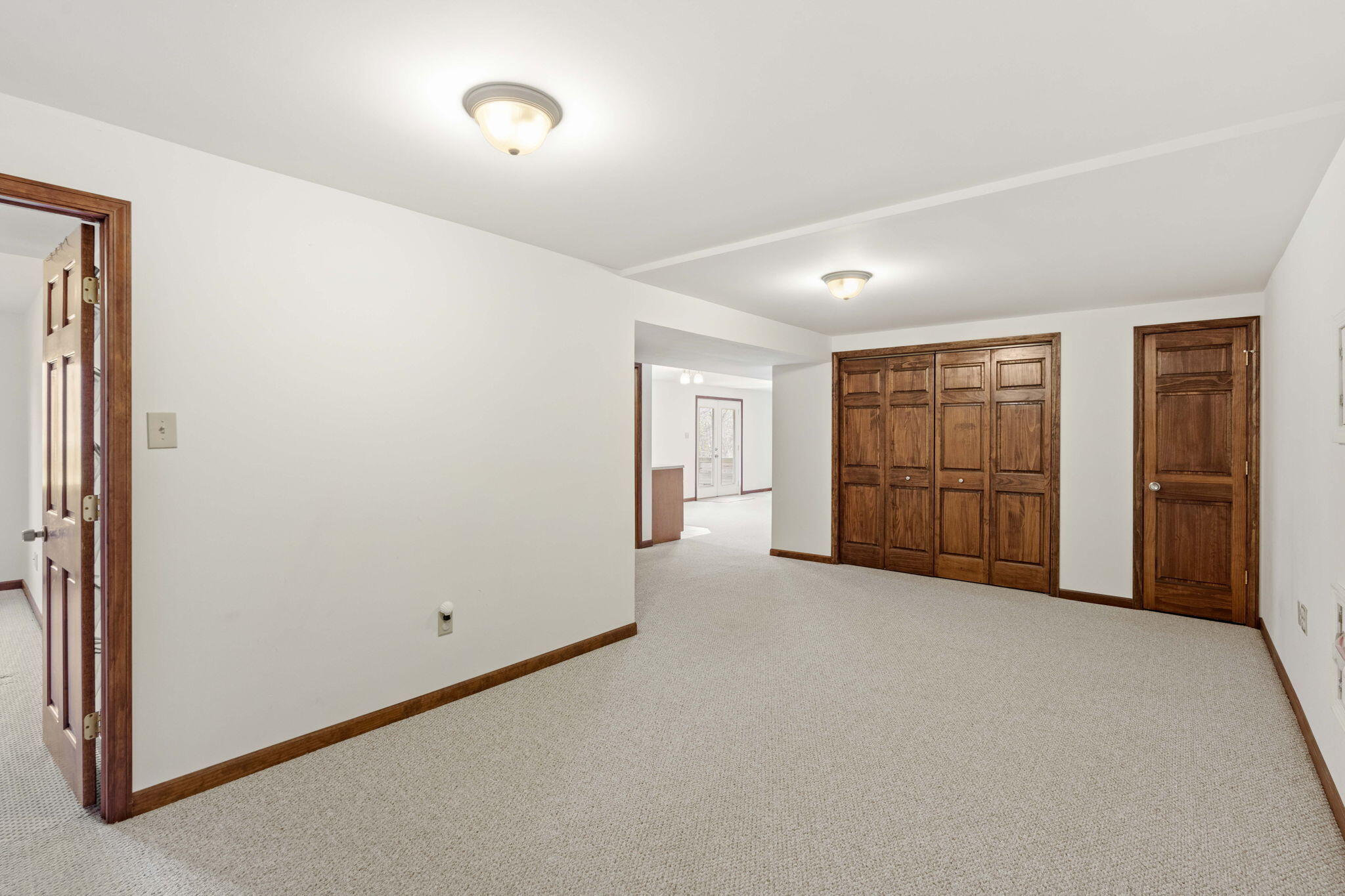 654 Harvest Court Crown Point, IN 46307 - Photo 26 of 43 an empty room with a cabinet and mirrors