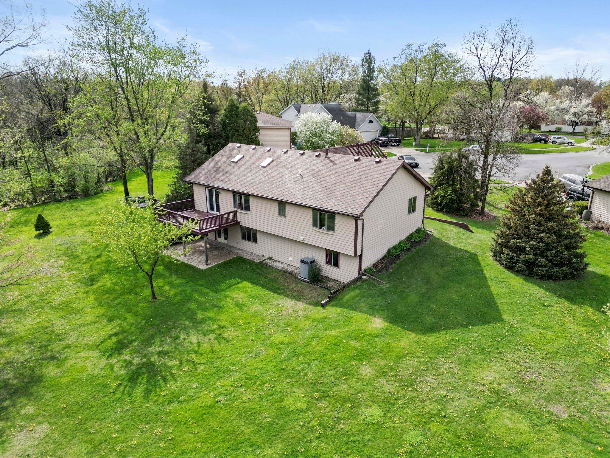654 Harvest Court Crown Point, IN 46307 - Photo 34 of 43 a aerial view of a house with table and chairs
