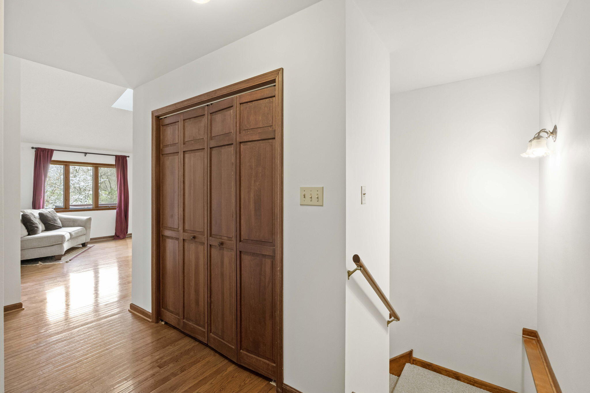 654 Harvest Court Crown Point, IN 46307 - Photo 5 of 43 a view of a hallway with wooden floor and closet