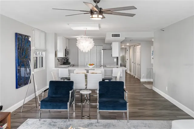 a bathroom with a sink a toilet a mirror and shower