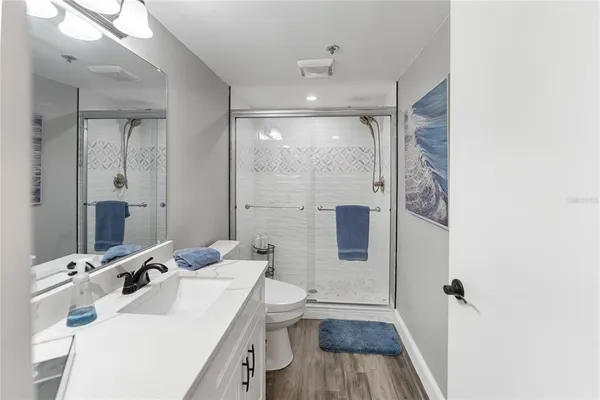 a bathroom with a double vanity sink and mirror