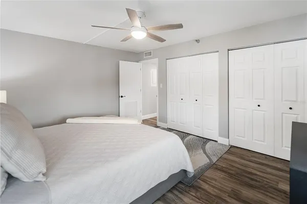 a bed room with a bed and a window