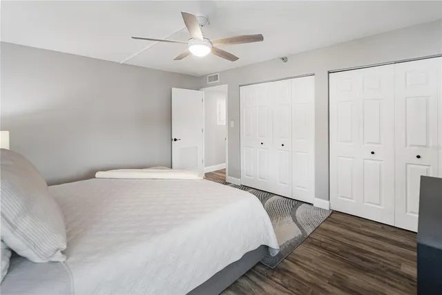 a bathroom with a double vanity sink and mirror