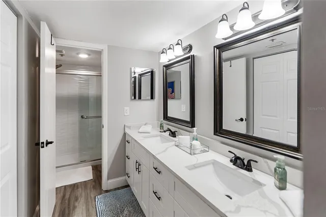 a bedroom with a bed and a mirror