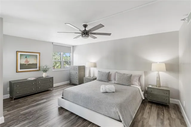 a bedroom with a bed and a mirror