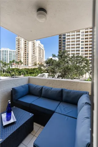 a view of balcony with couch and outdoor seating