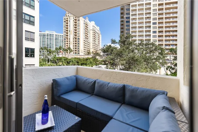 an aerial view of a house with garden space and street view