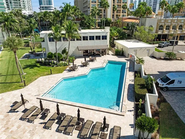 an aerial view of a house with outdoor space