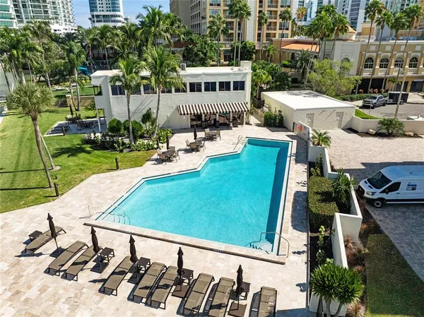 a view of a swimming pool with a lounge chairs