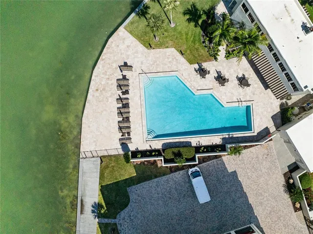 a view of a swimming pool with a patio