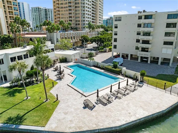 a view of a backyard with sitting area