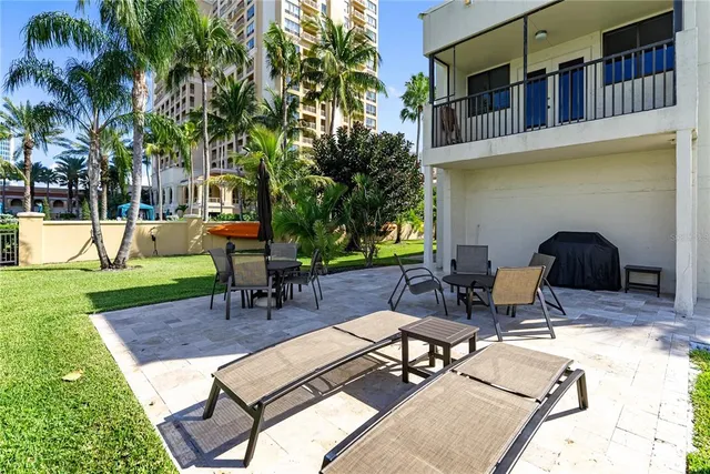 a front view of a building with palm trees