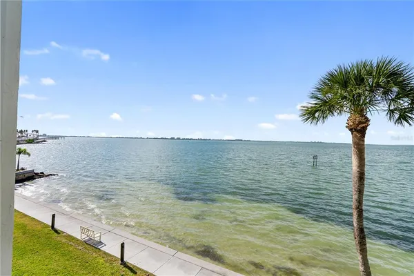 a view of a balcony with an ocean