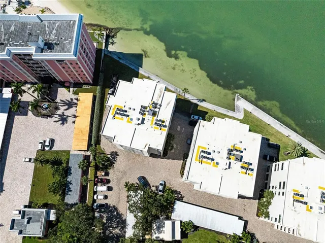 an aerial view of a house with a ocean view