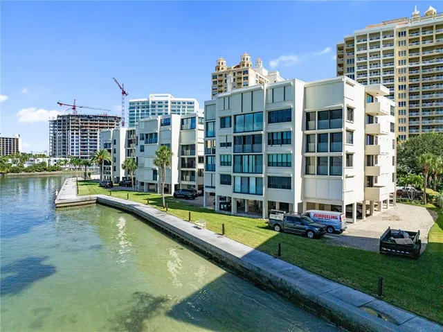 swimming pool view with a lake view