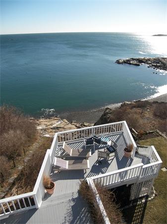 19 Summit Road Marblehead, MA 01945 - Photo 1 of 23 a view of a roof deck with couches and ocean view