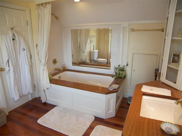 19 Summit Road Marblehead, MA 01945 - Photo 12 of 23 a bathroom with a tub a sink and a large mirror