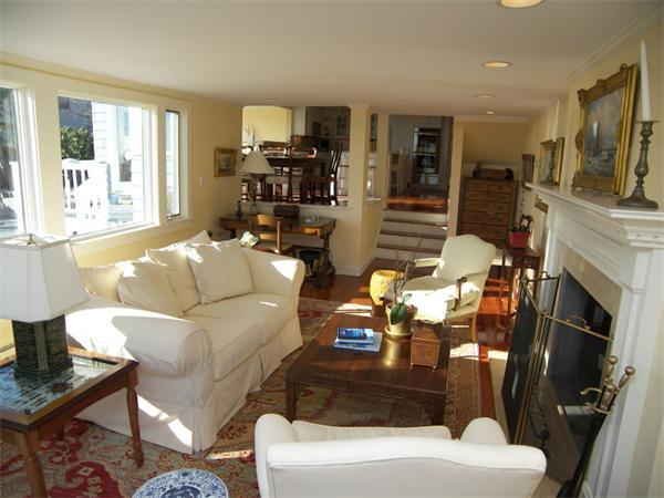 19 Summit Road Marblehead, MA 01945 - Photo 3 of 23 a living room with furniture a fireplace a flat screen tv and a large window