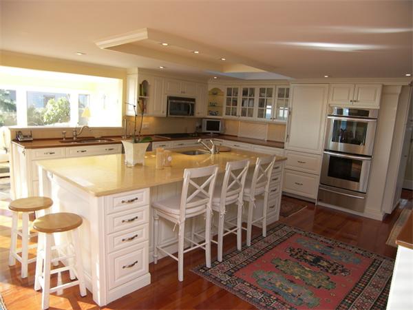 19 Summit Road Marblehead, MA 01945 - Photo 4 of 23 a open kitchen with stainless steel appliances granite countertop a stove and a refrigerator