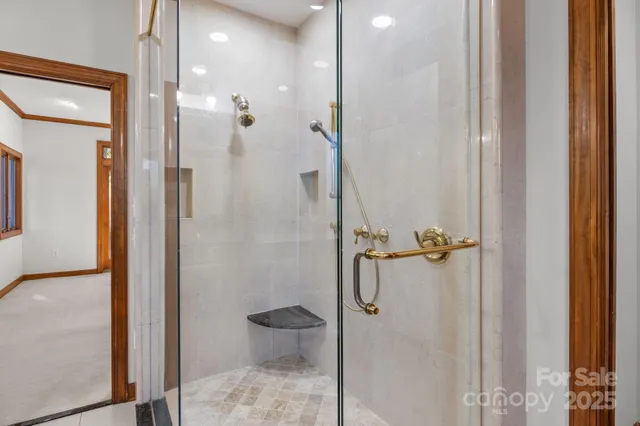 a bathroom with a granite countertop shower