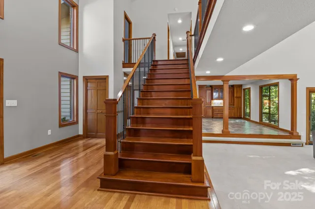 a view of entryway and hall with wooden floor