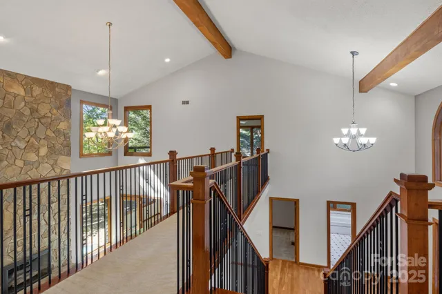 a view of a hallway with windows