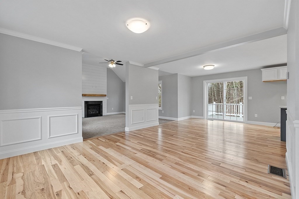 162 French Road Templeton, MA 01468 - Photo 8 of 40 a view of empty room with wooden floor and fireplace