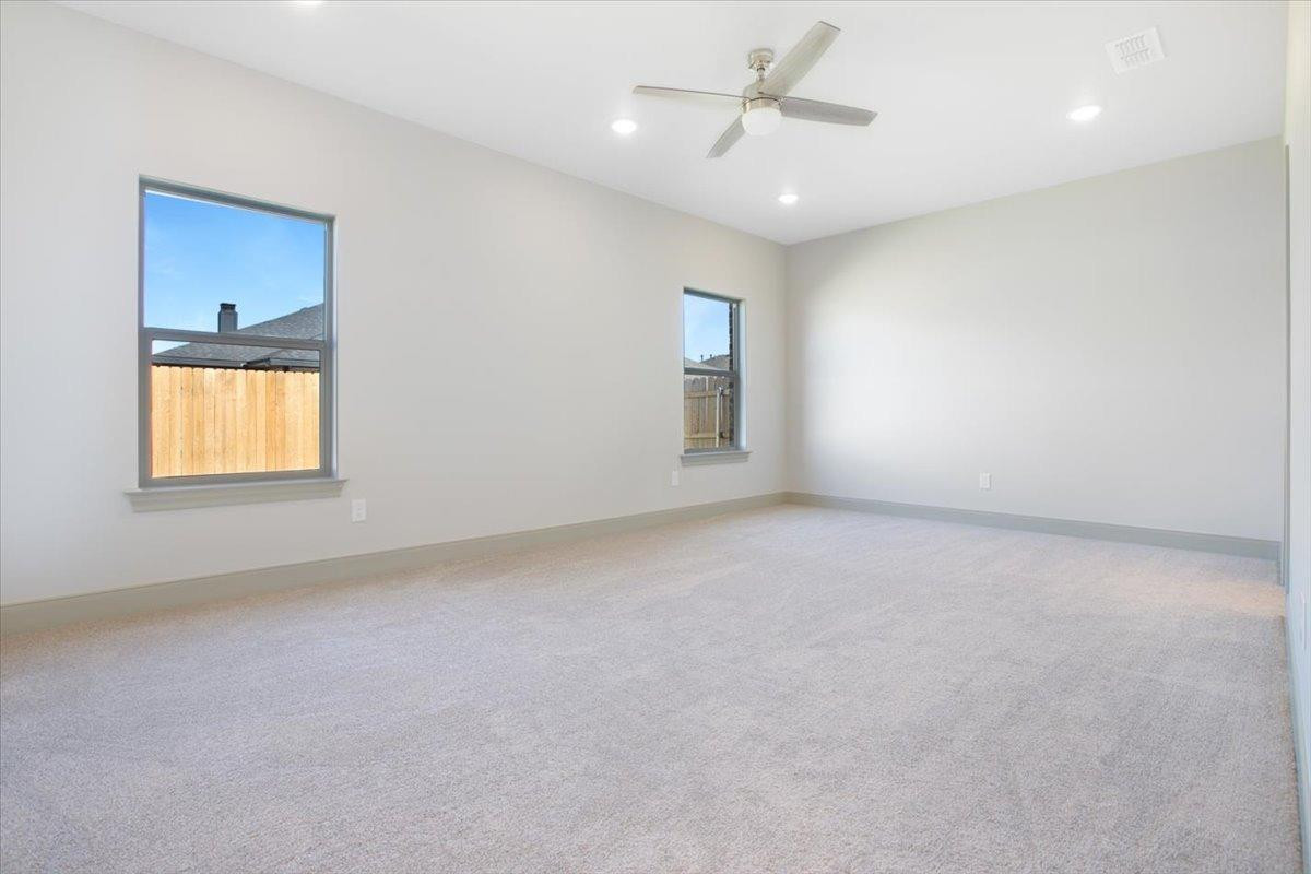 5846 Harvard Street Lubbock, TX 79416 - Photo 11 of 24 an empty room with a empty space and windows