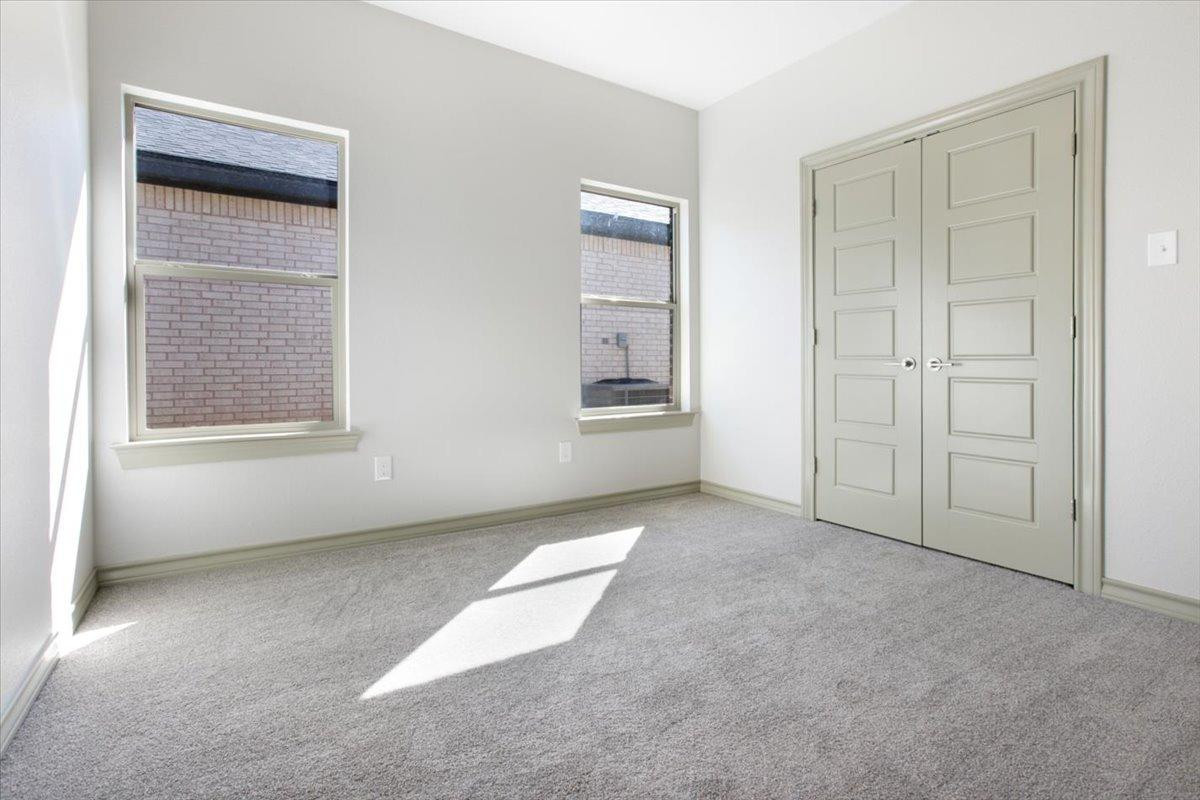 5846 Harvard Street Lubbock, TX 79416 - Photo 15 of 24 an empty room with windows and closet