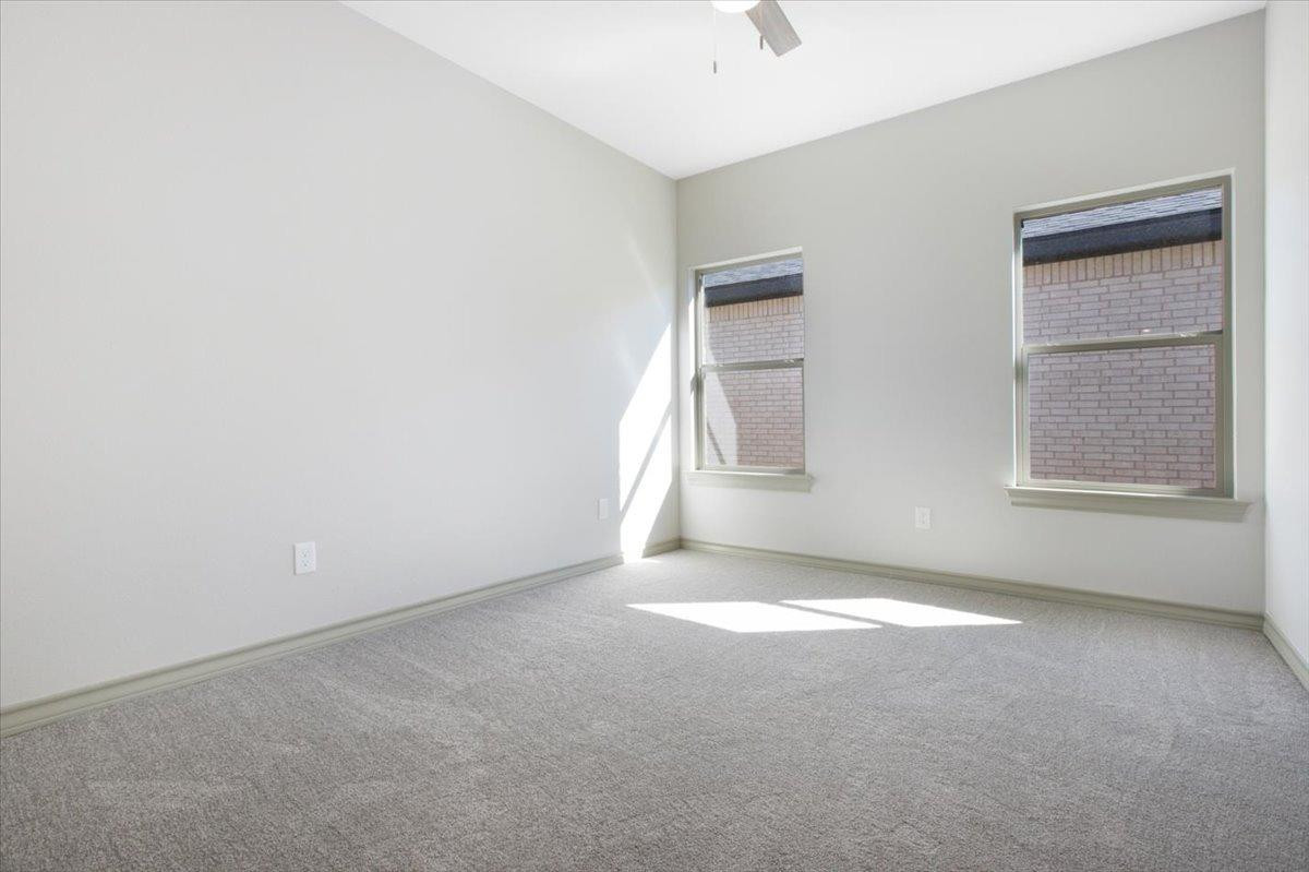 5846 Harvard Street Lubbock, TX 79416 - Photo 16 of 24 an empty room with windows and closet