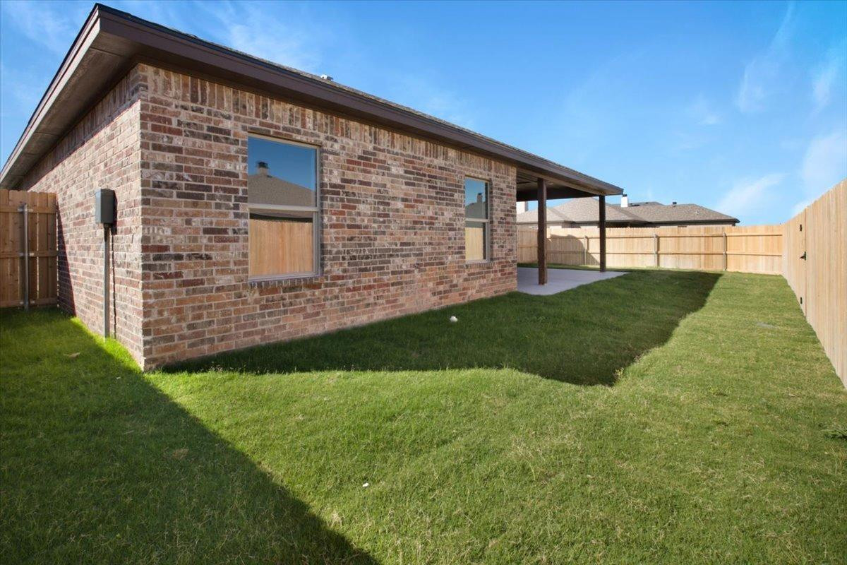 5846 Harvard Street Lubbock, TX 79416 - Photo 22 of 24 a view of a backyard with plants