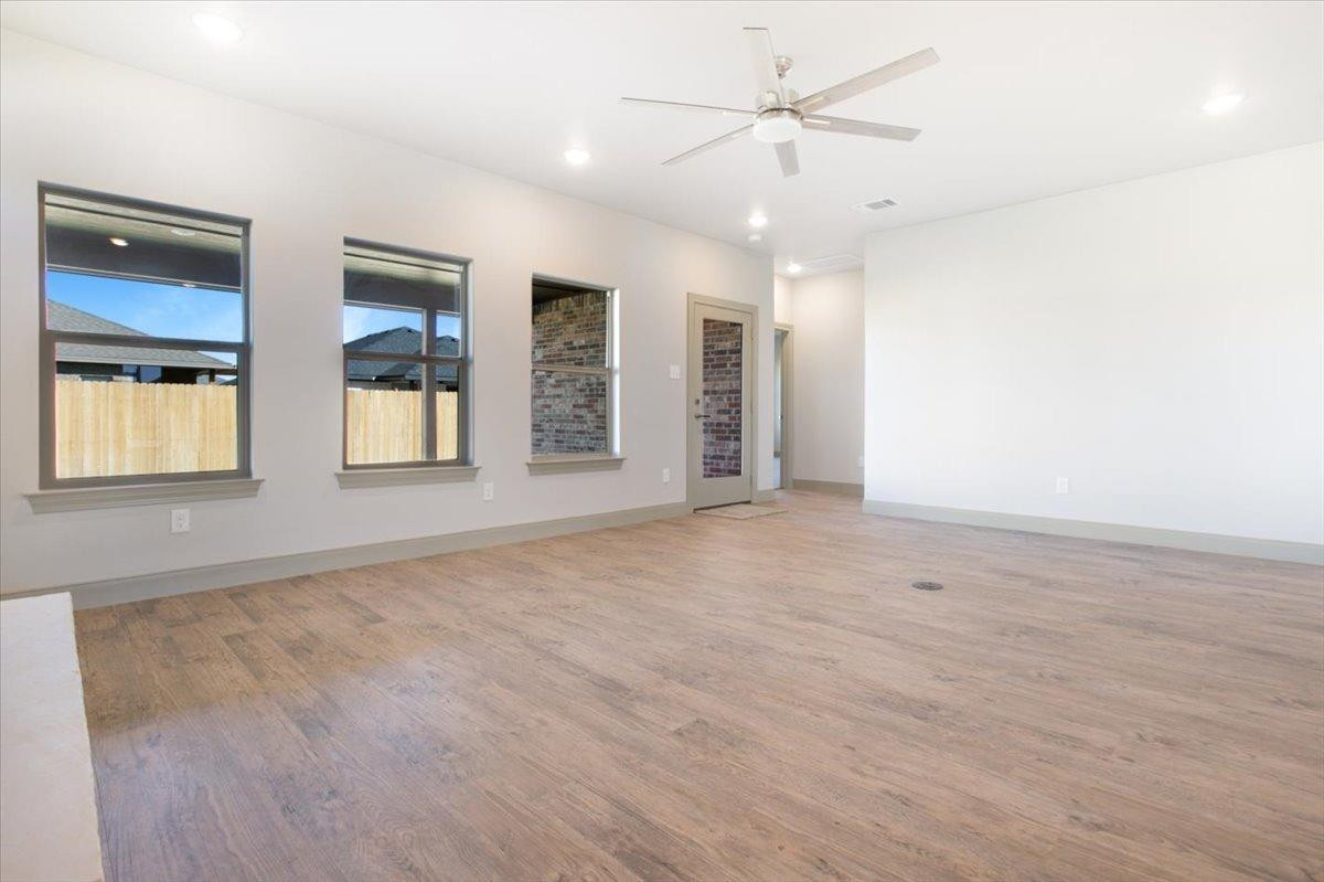 5846 Harvard Street Lubbock, TX 79416 - Photo 5 of 24 a view of an empty room with a window
