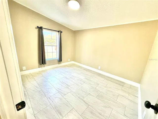 a view of a big room with windows