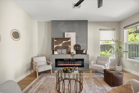 a living room with furniture and a fireplace