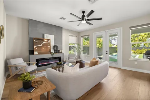 a living room with furniture and a large window