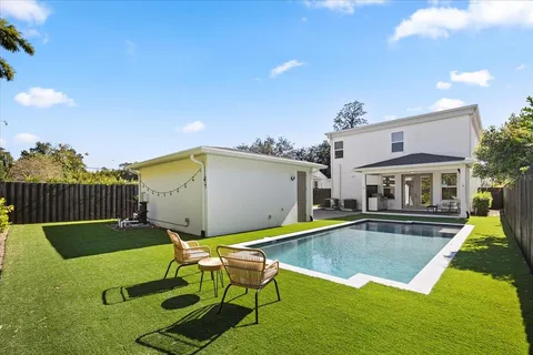 swimming pool view with seating space