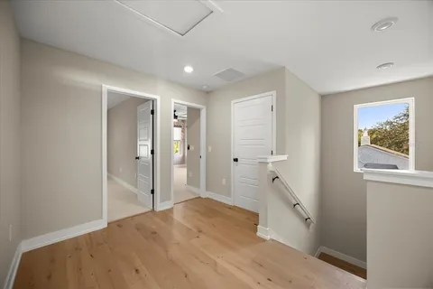 a spacious bathroom with a shower sink and mirror