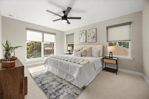 a bedroom with a large bed and a window