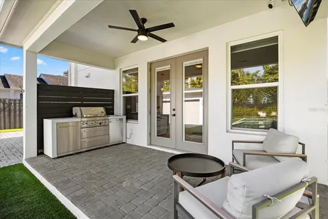 a living room with furniture and a floor to ceiling window