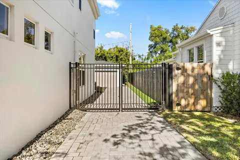a view of a gate with wooden fence