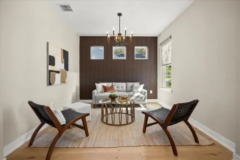 a dining room with furniture and window
