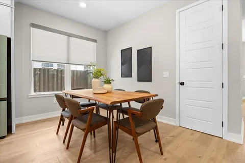 a dining room with furniture and window