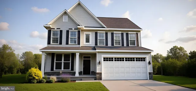 a front view of a house with a yard table and chairs