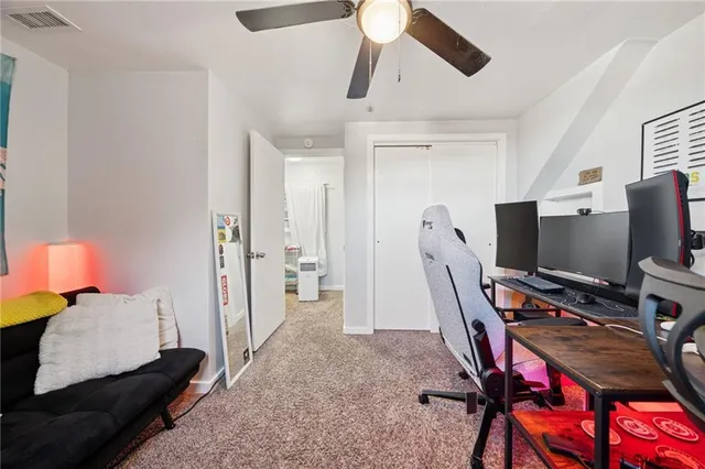 a bedroom with furniture and a window