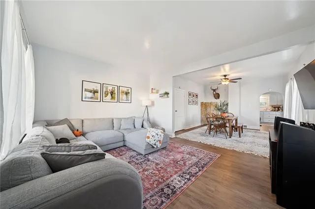 a living room with furniture and a table