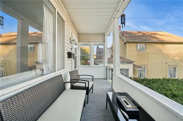a view of a house with a yard and deck