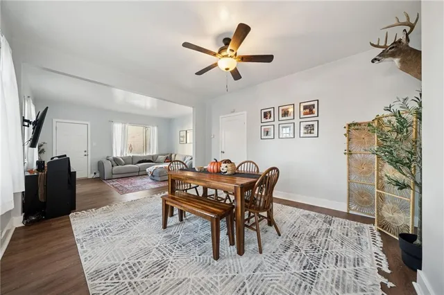 a dining room with furniture and window