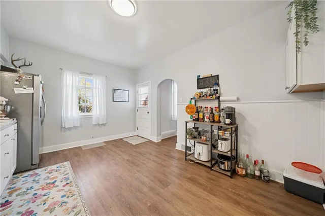 a bedroom with furniture and a wooden floor